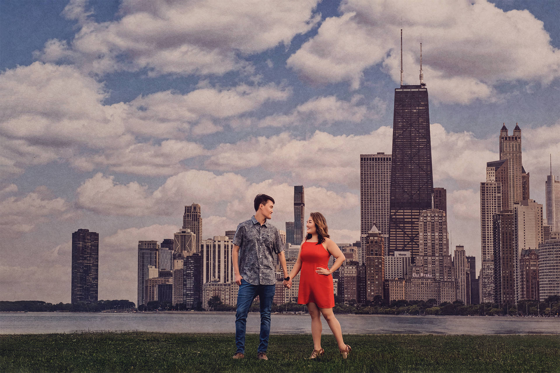Couple photographed by the Chicago lakefront and skyline