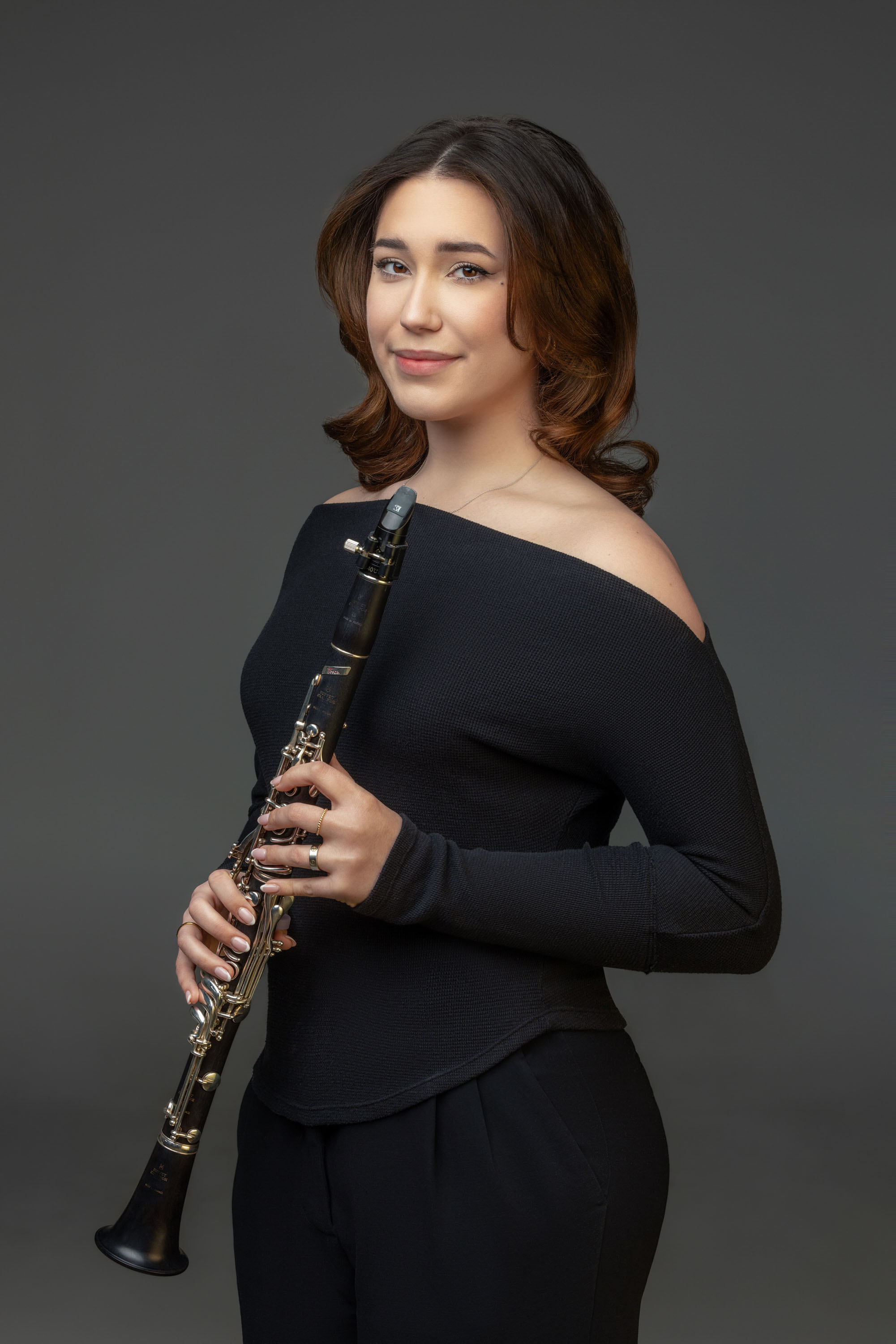 Musician holding a clarinet for an artist portrait