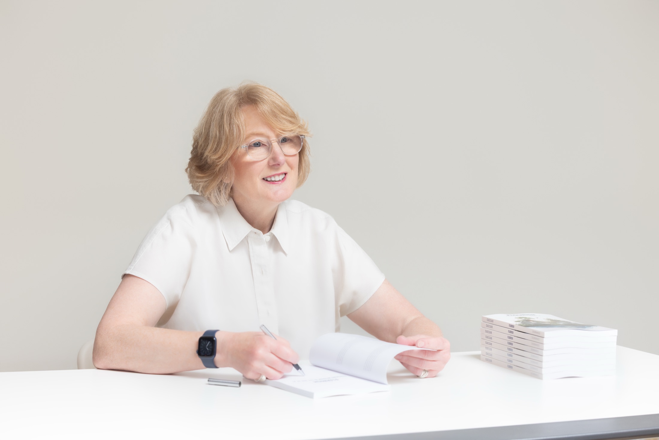 Author at a book signing table