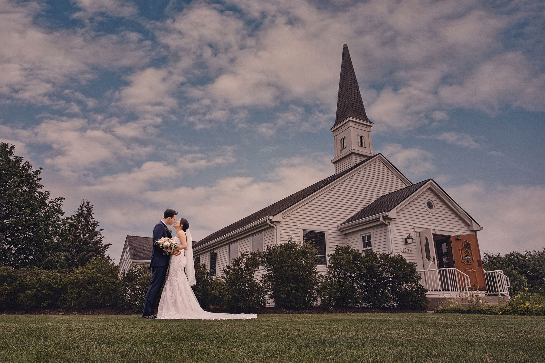 Couple in wedding attire outside a Glenview church