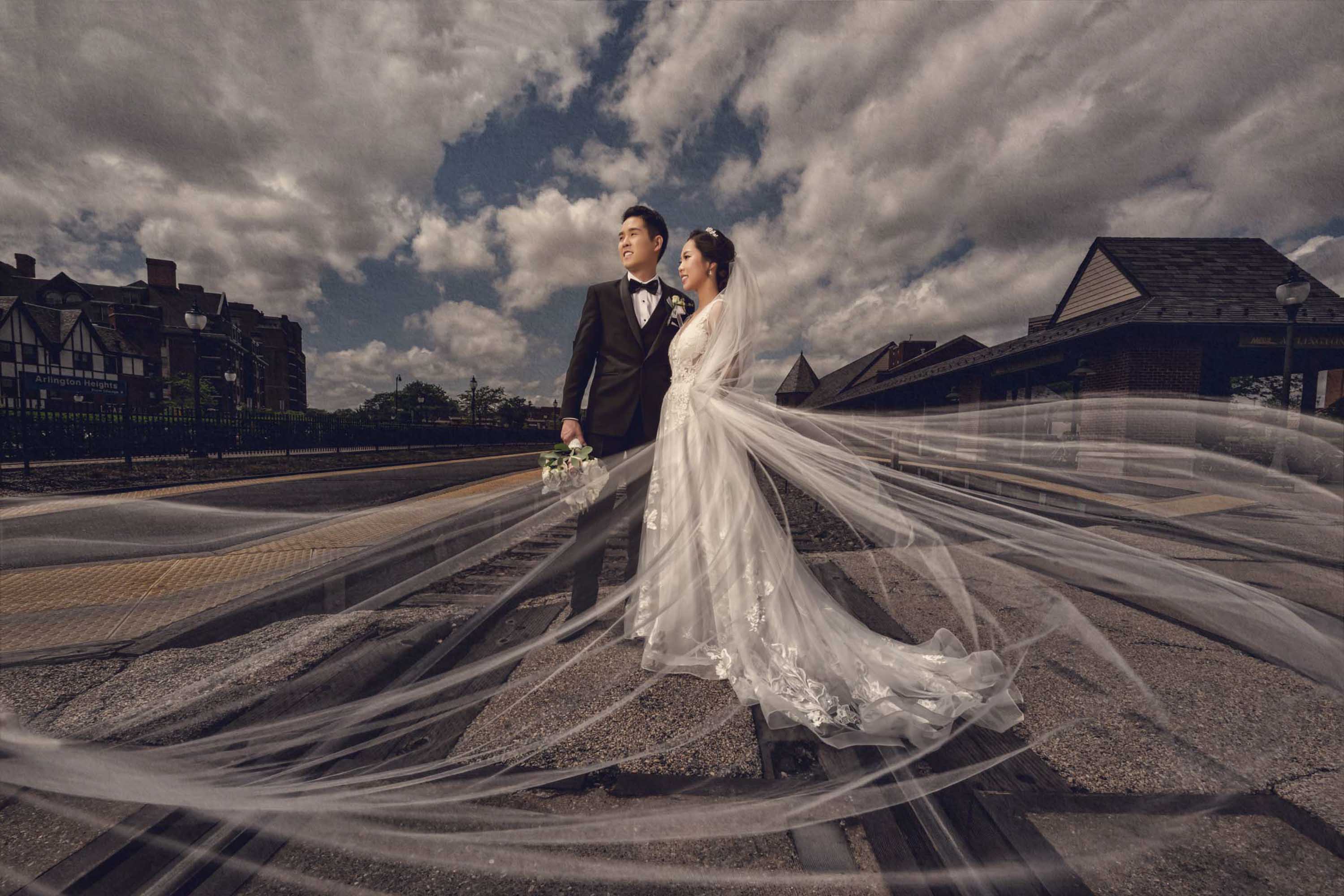 Wedding portrait with a flowing veil outdoors